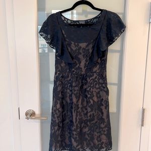 Delicate navy blue sheer dress with nude under layer